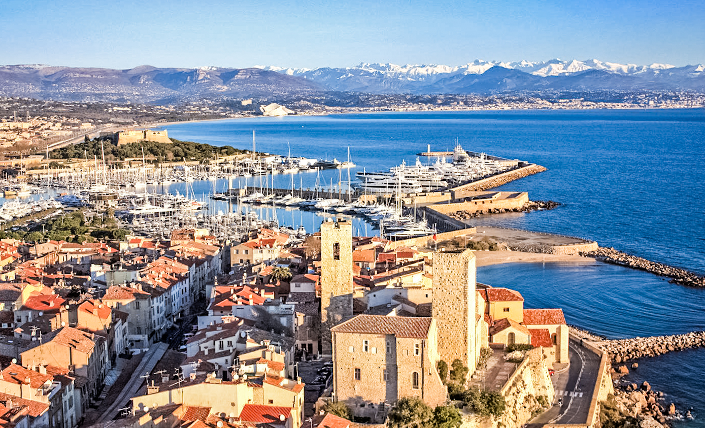 french riviera in winter with alps in the back