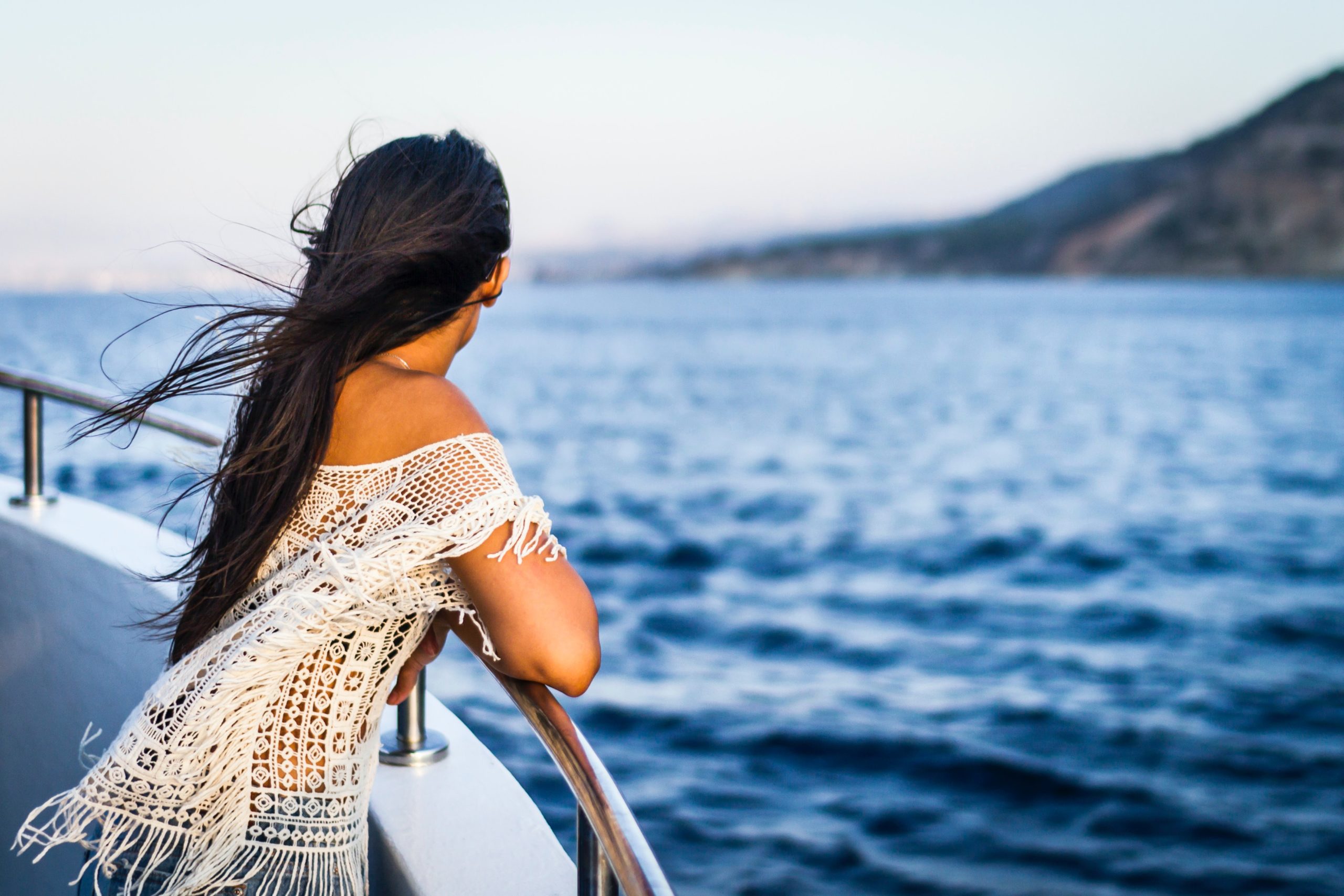 girl looking over water in cannes on a cruise ships