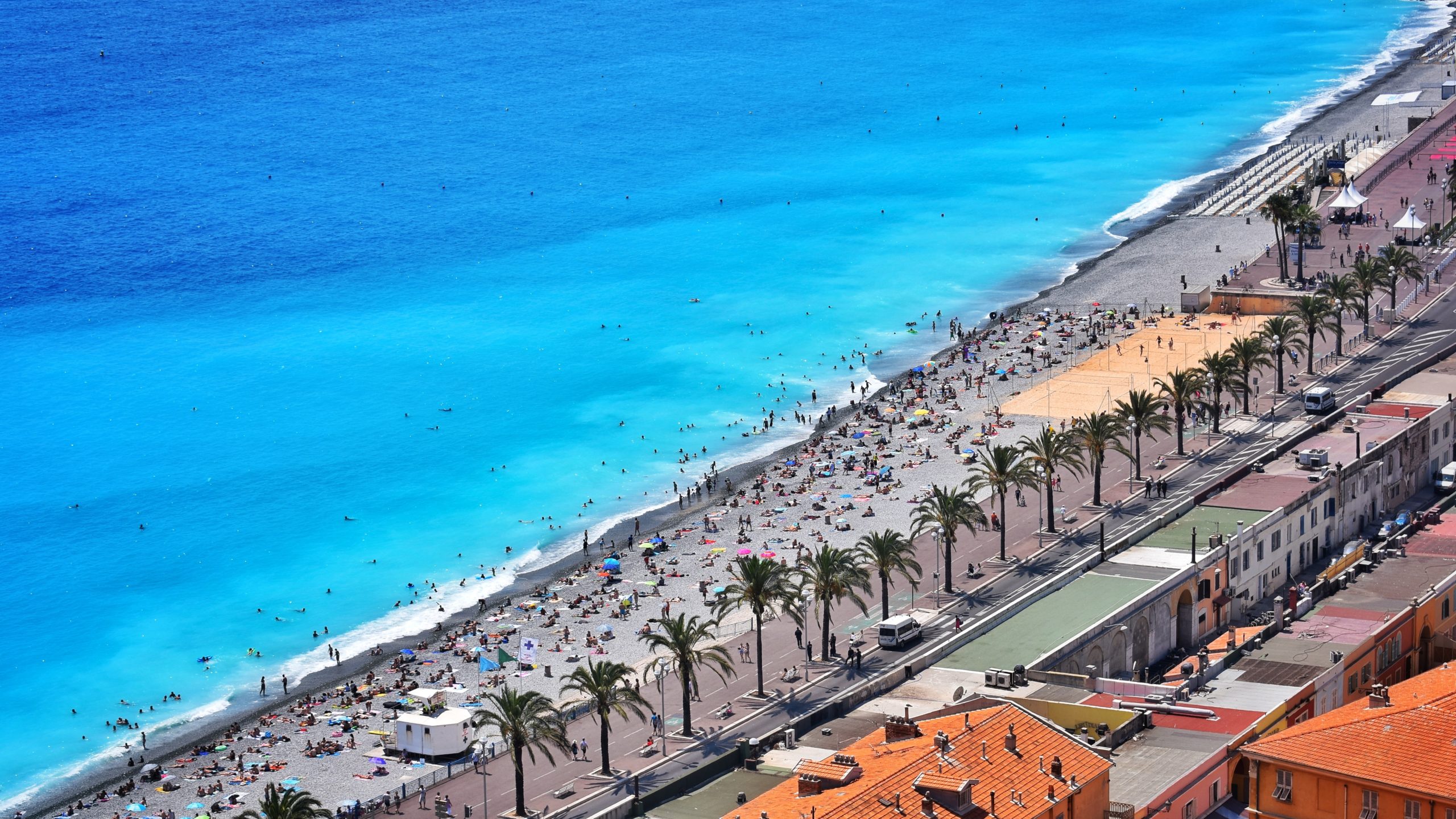 crowded beach Nice France from USA